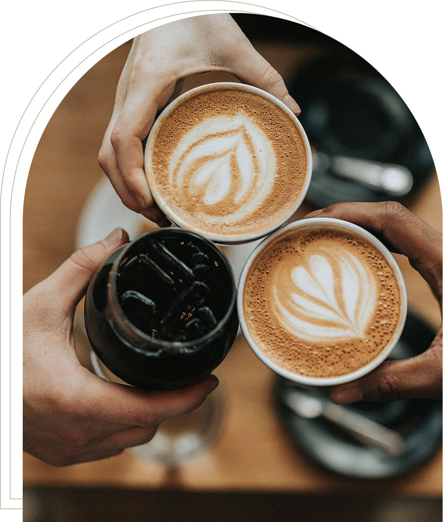 Café coffee cup with latte art on wooden table